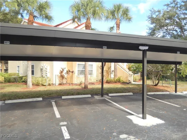 a living room with fireplace furniture and a large window