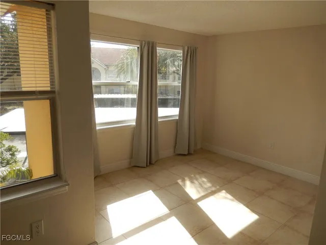 a view of an empty room and window