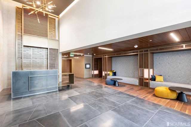 a view of a lobby with furniture and front door