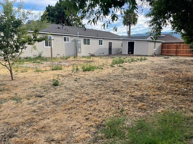 411 Lewis Street Gilroy, CA 95020 - Photo 19 of 22 a house that has a tree in front of it