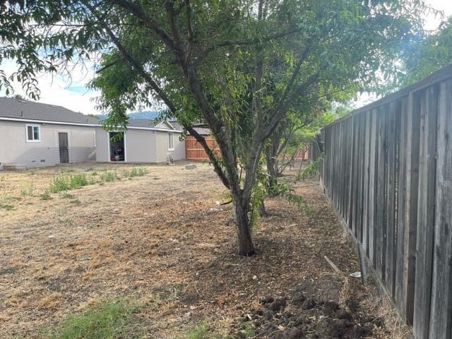 411 Lewis Street Gilroy, CA 95020 - Photo 20 of 22 a view of a house with a tree in the background