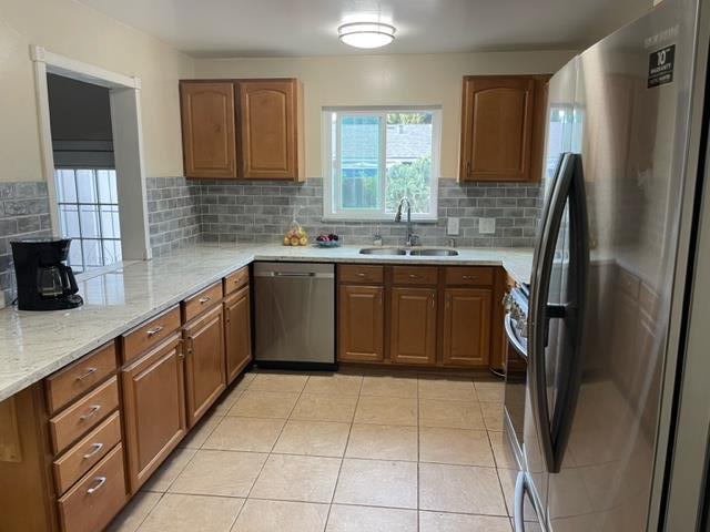 411 Lewis Street Gilroy, CA 95020 - Photo 5 of 22 a kitchen with stainless steel appliances granite countertop a sink stove and refrigerator