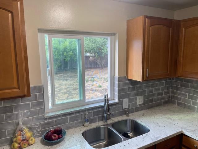 411 Lewis Street Gilroy, CA 95020 - Photo 6 of 22 a kitchen with a sink and a window