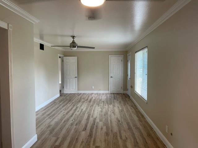 411 Lewis Street Gilroy, CA 95020 - Photo 7 of 22 wooden floor in an empty room with a window