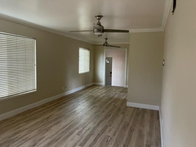 411 Lewis Street Gilroy, CA 95020 - Photo 8 of 22 a view of empty room with wooden floor and fan
