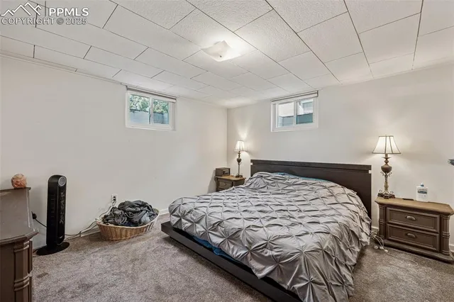 a bedroom with a bed and a desk