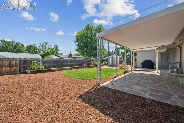 a view of a backyard with a garden