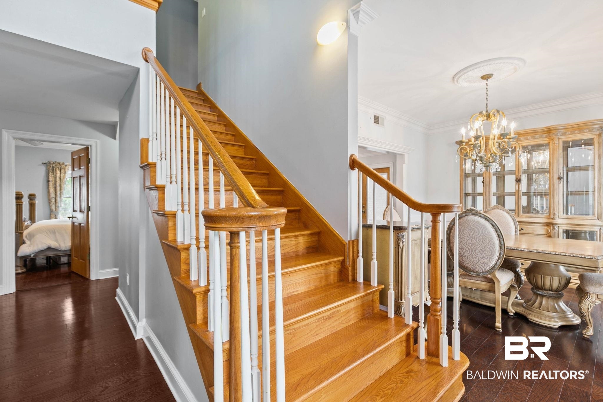 2 Speckle Trout Route Daphne, AL 36527 - Photo 25 of 61 Stairs featuring wood finished floors, a chandelier, and ornamental molding