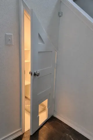 a view of front door with wooden floor