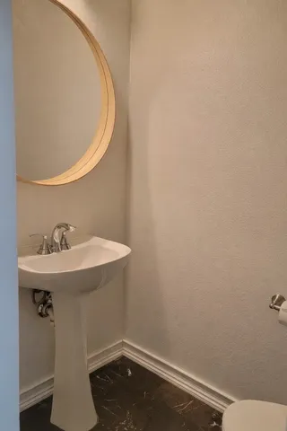 a bathroom with a sink and vanity