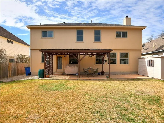 a house that has a big yard in front of it