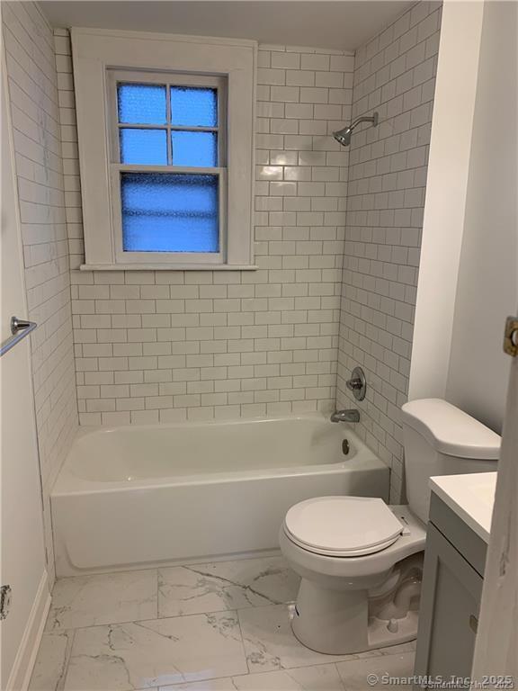 181 Fox Street, Unit 2 Bridgeport, CT 06605 - Photo 5 of 7 a bathroom with a toilet a sink and bathtub