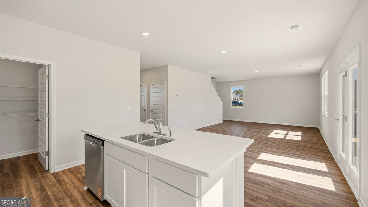 8578 Seabiscuit Road Lithonia, GA 30058 - Photo 11 of 30 a bathroom with a sink and a mirror