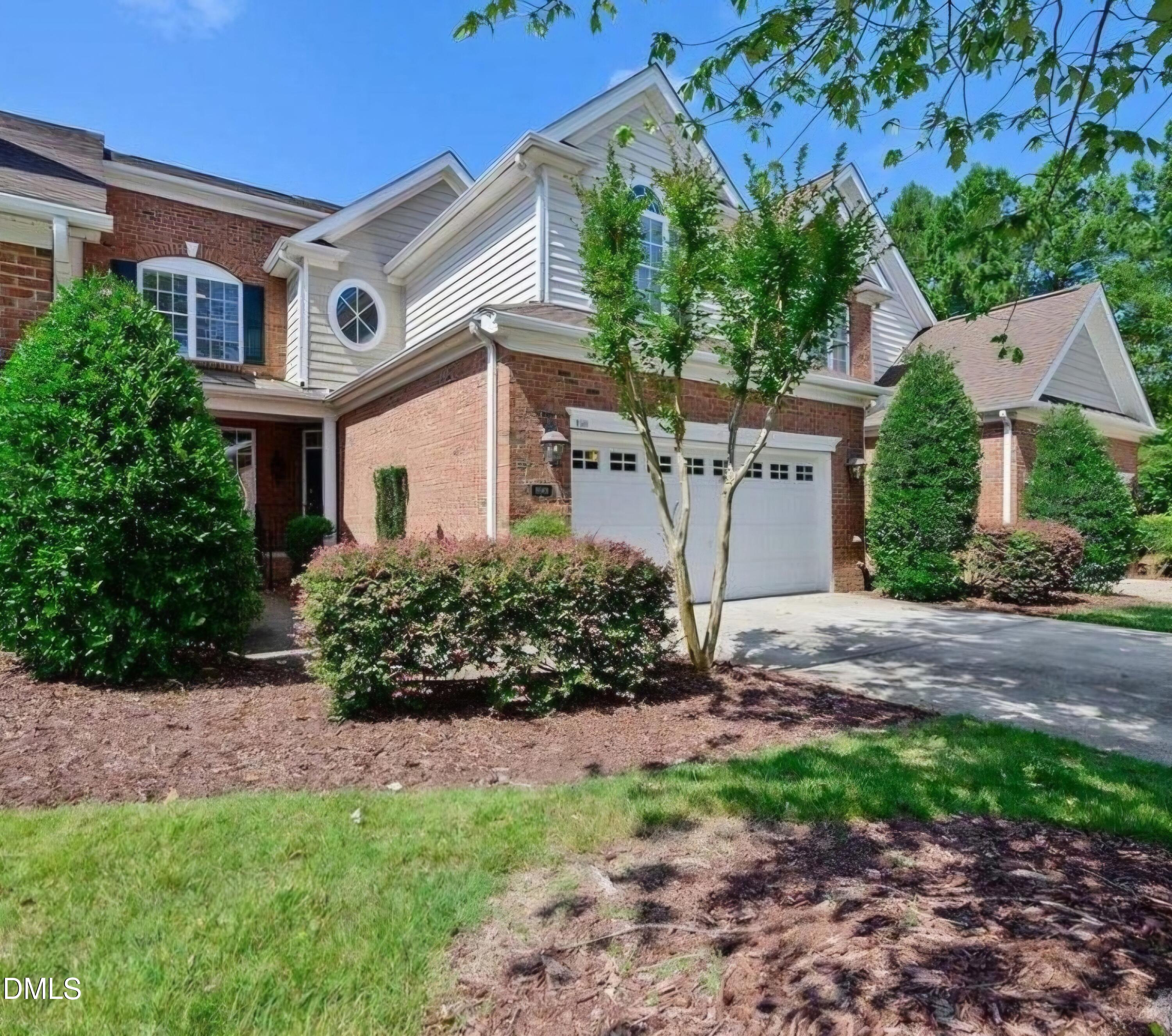 9569 Brookchase Drive Raleigh, NC 27617 - Photo 1 of 7 a front view of a house with a yard
