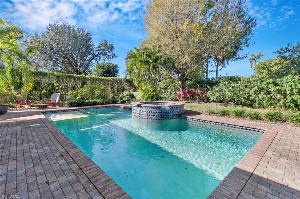 1999 Alamanda Drive Naples, FL 34102 - Photo 18 of 24 a backyard of a house with lots of green space