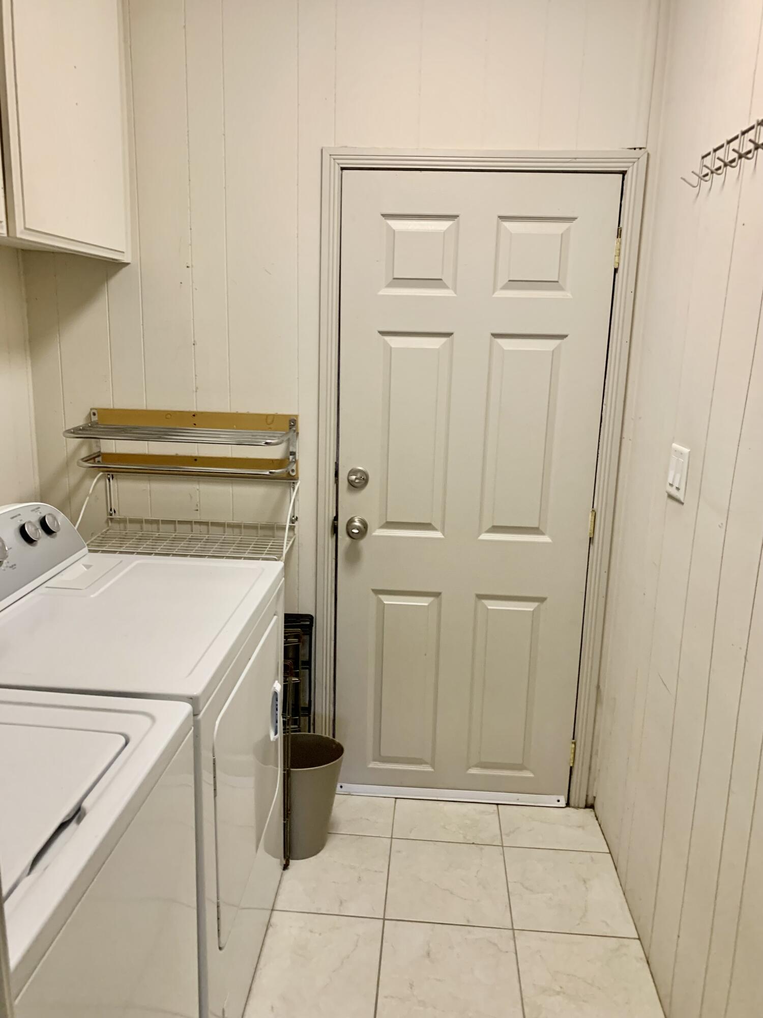 169 Tanforan Rancho Mirage, CA 92270 - Photo 16 of 19 a view of a storage and utility room with washer and dryer