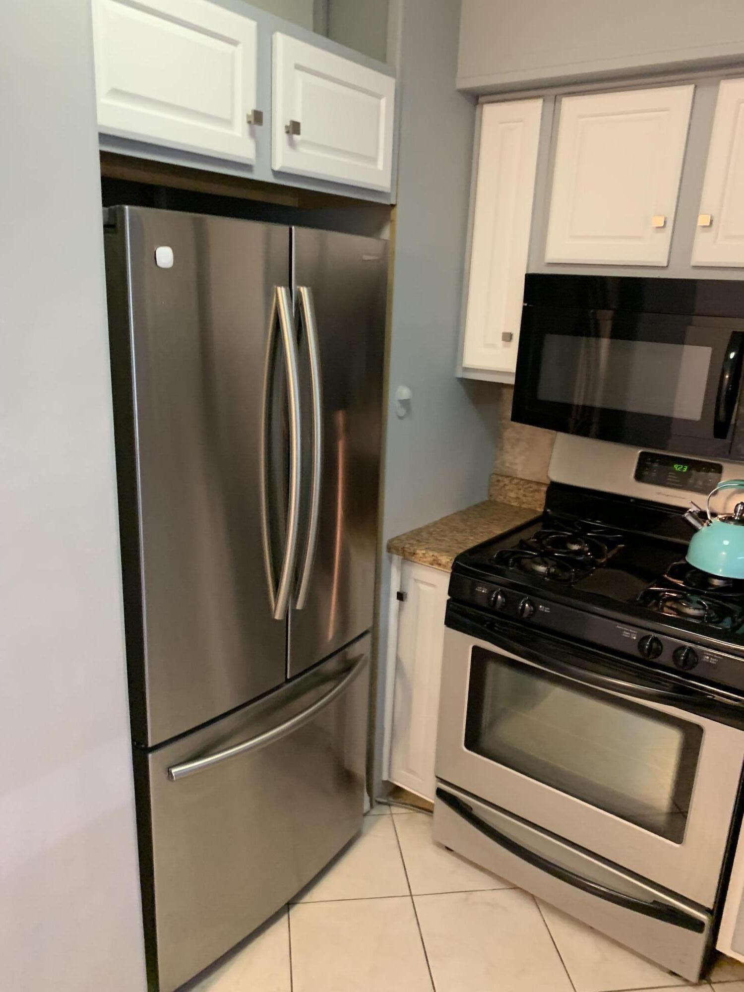 169 Tanforan Rancho Mirage, CA 92270 - Photo 5 of 19 a close view of a stove and a microwave