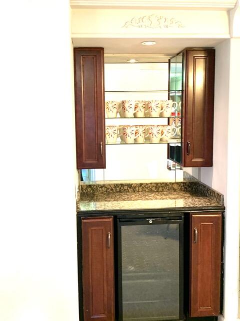 169 Tanforan Rancho Mirage, CA 92270 - Photo 7 of 19 a room with granite countertop cabinets and sink