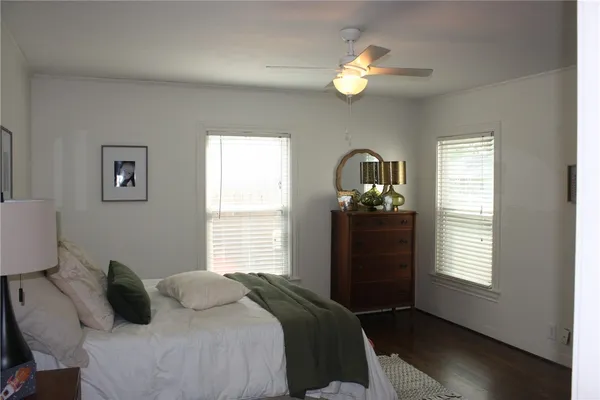 a bedroom with a bed and window