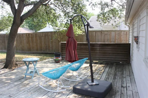 a view of a backyard with sitting area