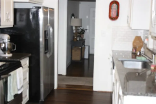a bathroom with a sink and mirror