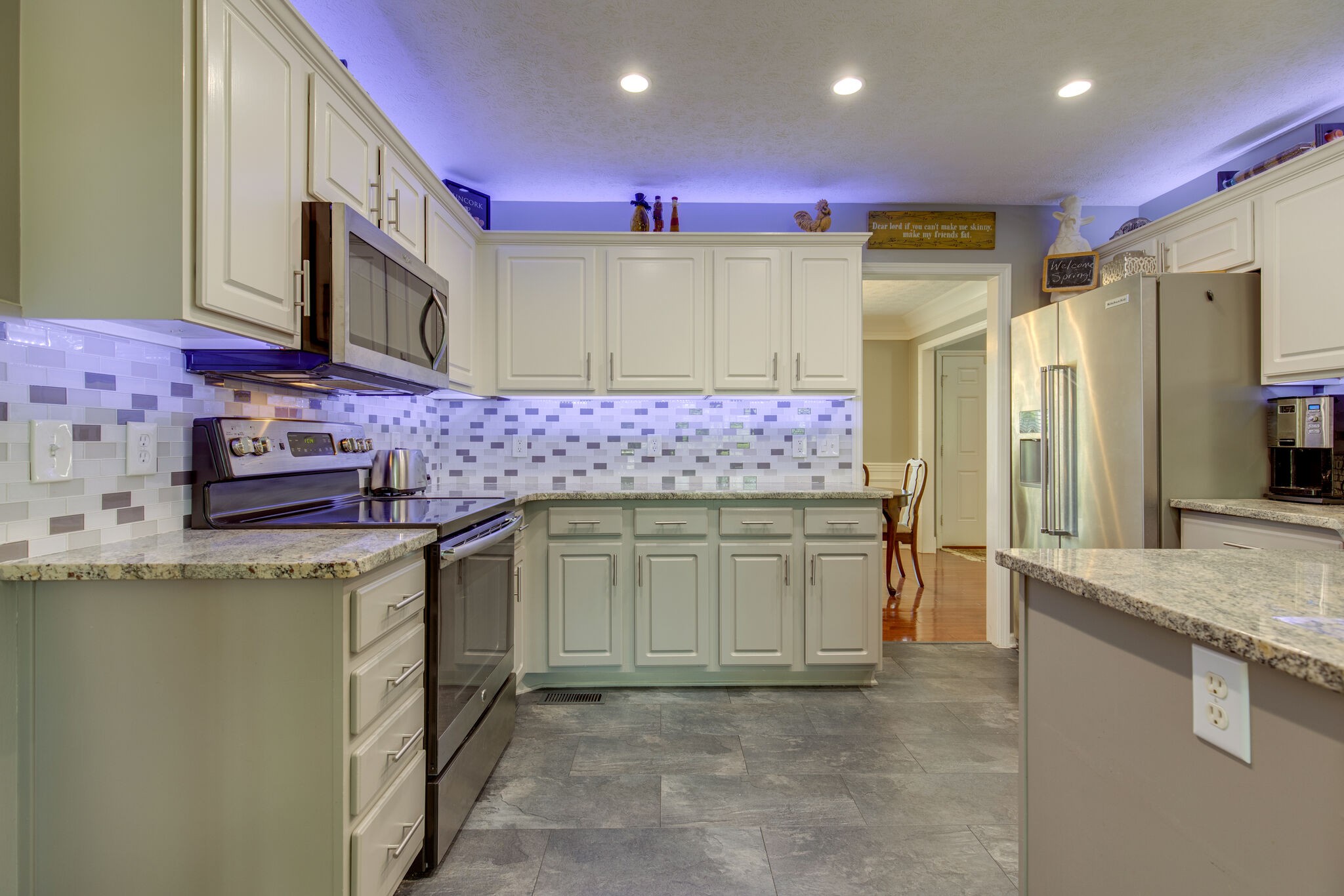 5236 Ridgefalls Way Antioch, TN 37013 - Photo 12 of 35 a kitchen with stainless steel appliances granite countertop a sink stove and cabinets