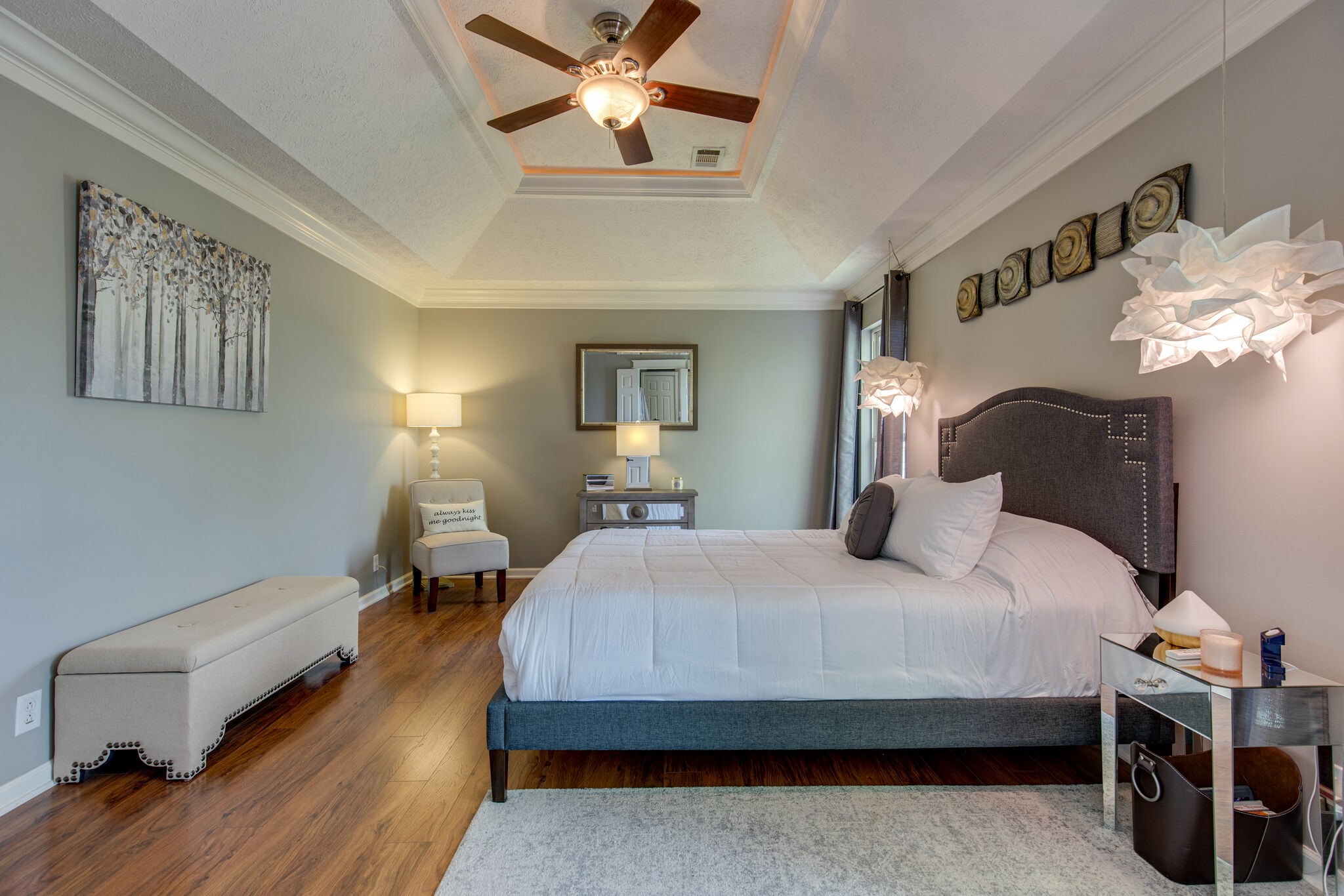 5236 Ridgefalls Way Antioch, TN 37013 - Photo 18 of 35 a bedroom with a bed and a chandelier