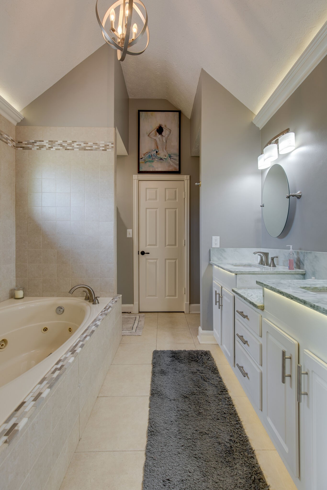 5236 Ridgefalls Way Antioch, TN 37013 - Photo 19 of 35 a spacious bathroom with a tub sink and mirror