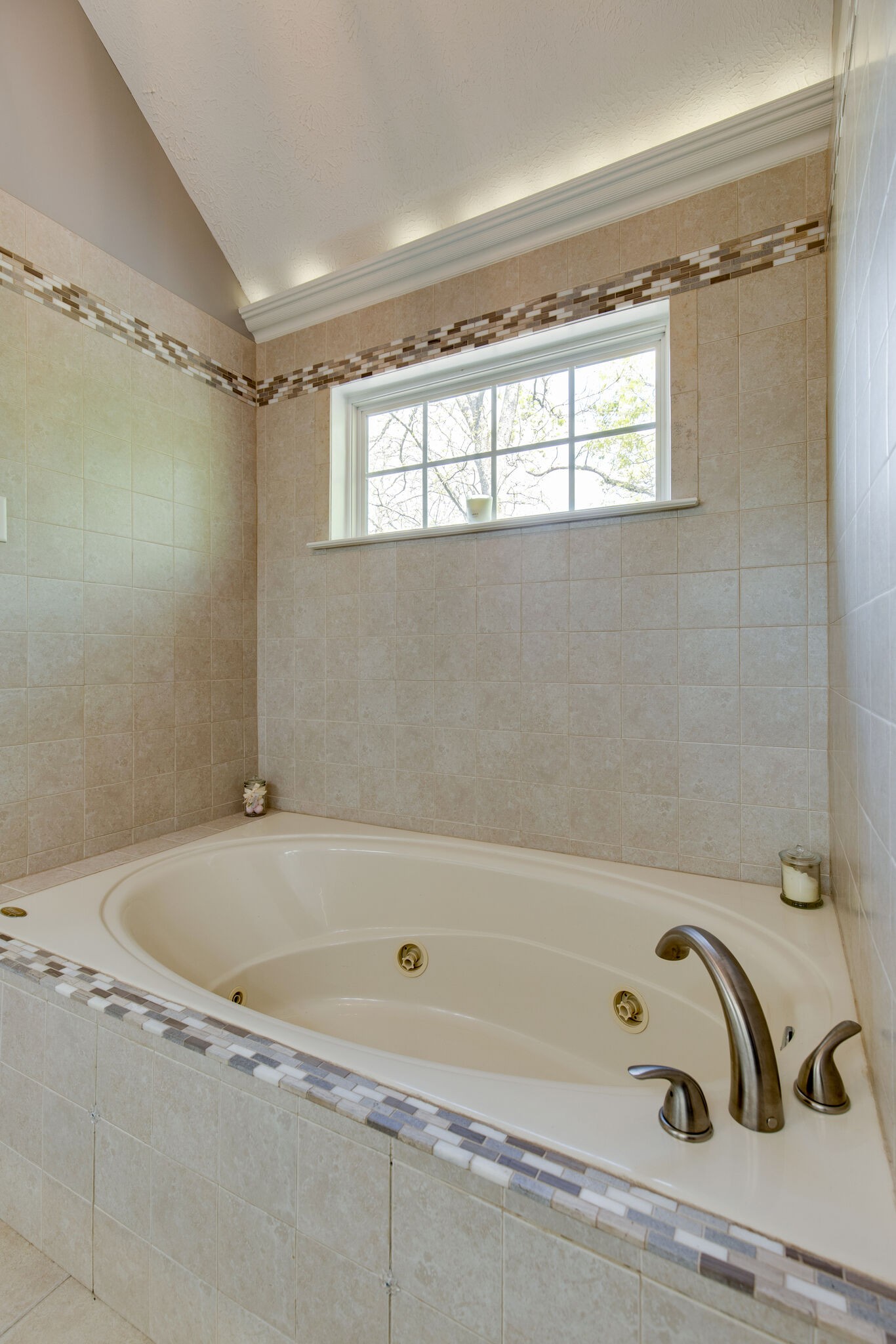 5236 Ridgefalls Way Antioch, TN 37013 - Photo 21 of 35 a bathroom with a bathtub and a window