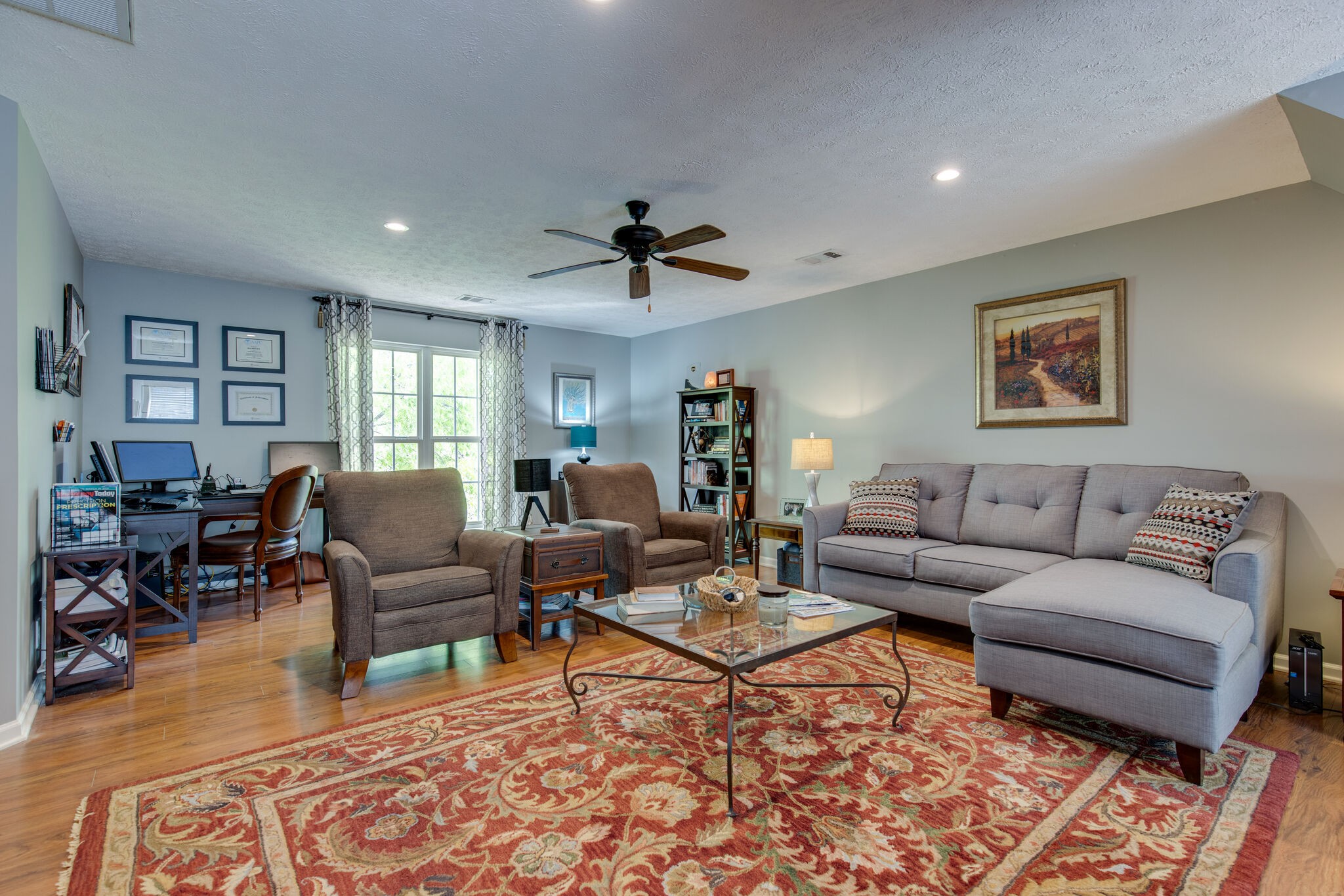 5236 Ridgefalls Way Antioch, TN 37013 - Photo 24 of 35 a living room with furniture and wooden floor
