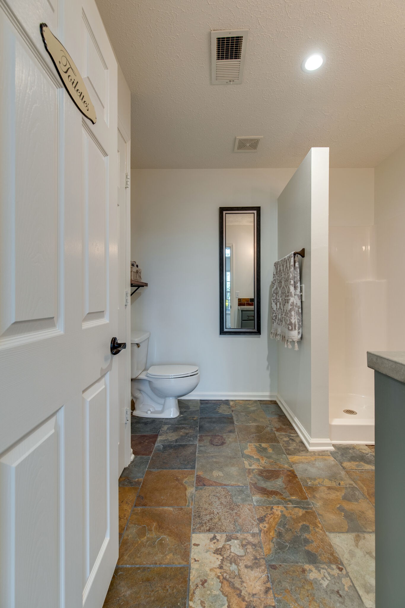 5236 Ridgefalls Way Antioch, TN 37013 - Photo 30 of 35 a bathroom with a toilet sink and shower