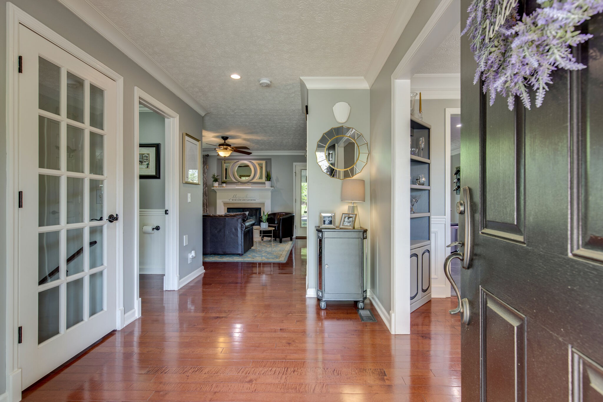 5236 Ridgefalls Way Antioch, TN 37013 - Photo 5 of 35 a view of a hallway with wooden floor and a living room