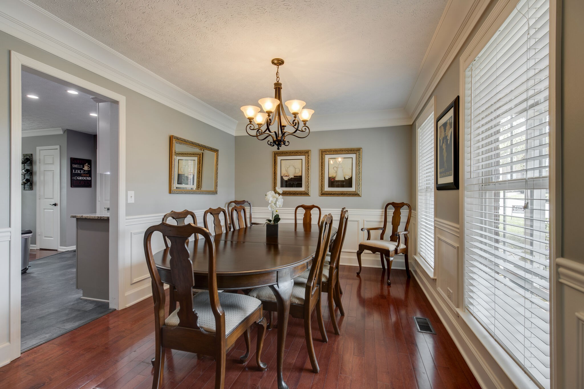 5236 Ridgefalls Way Antioch, TN 37013 - Photo 7 of 35 a view of a dining room with furniture a chandelier and wooden floor