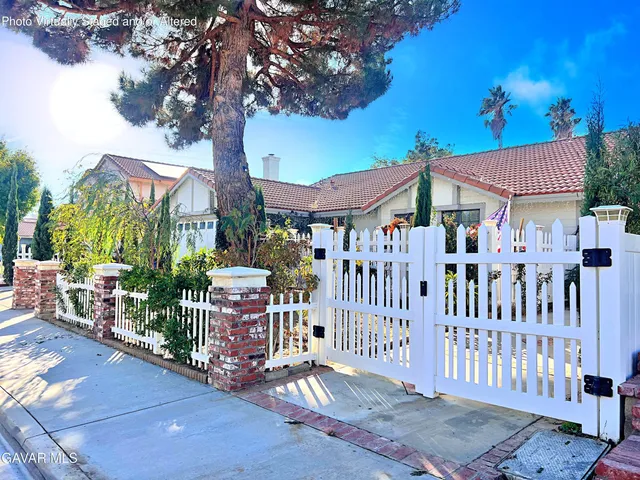 a view of a house with a small yard
