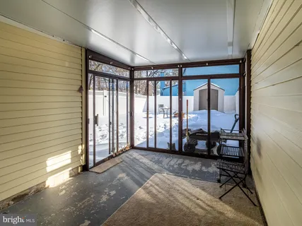 a view of an entrance to house with a window