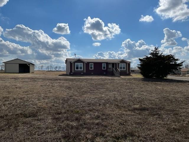 8578 County Road 502 Blue Ridge, TX 75424 - Photo 15 of 15 a view of a house with a big yard and a large tree