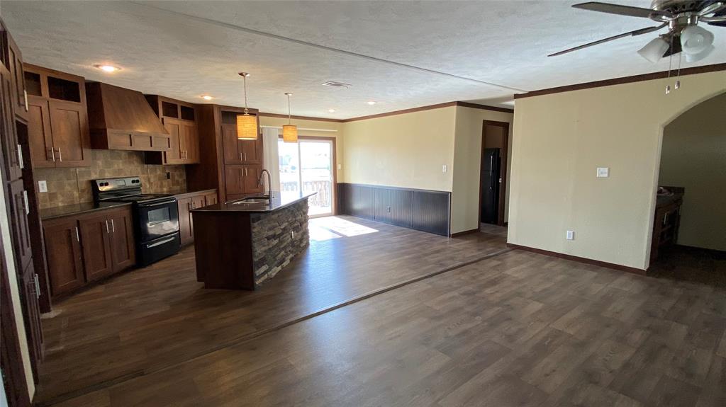 8578 County Road 502 Blue Ridge, TX 75424 - Photo 3 of 15 a kitchen with stainless steel appliances granite countertop a refrigerator a sink and a stove
