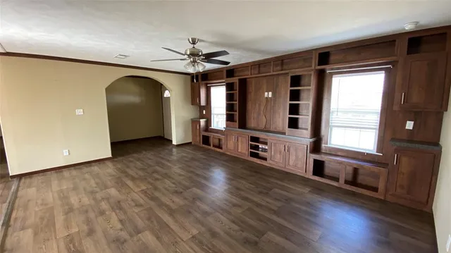 a bathroom with a granite countertop sink mirror and a bathtub