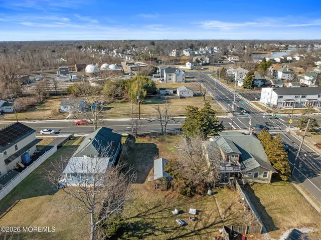 an aerial view of residential houses with city view