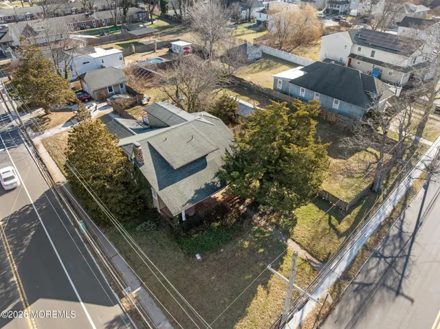 an aerial view of a city with ocean view