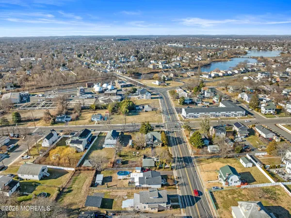 an aerial view of residential houses with city view