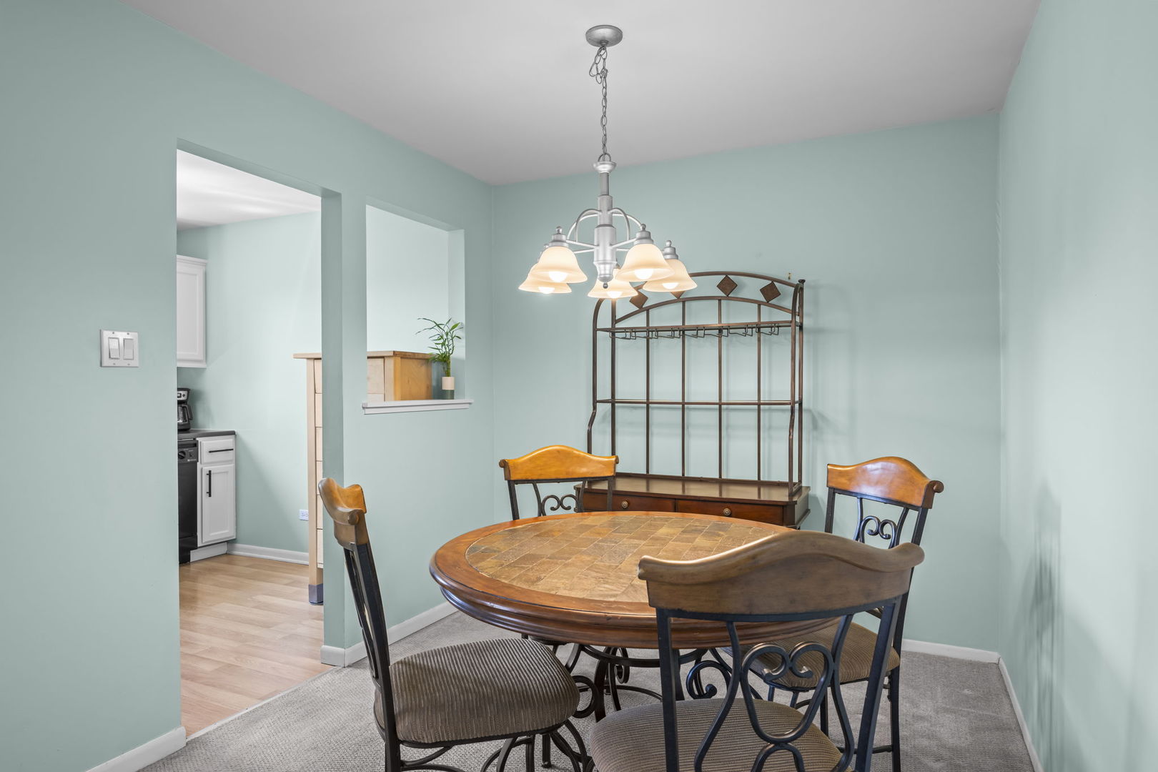 831 Coach Road, Unit 4 Palatine, IL 60074 - Photo 4 of 18 a view of a dining room with furniture window and wooden floor