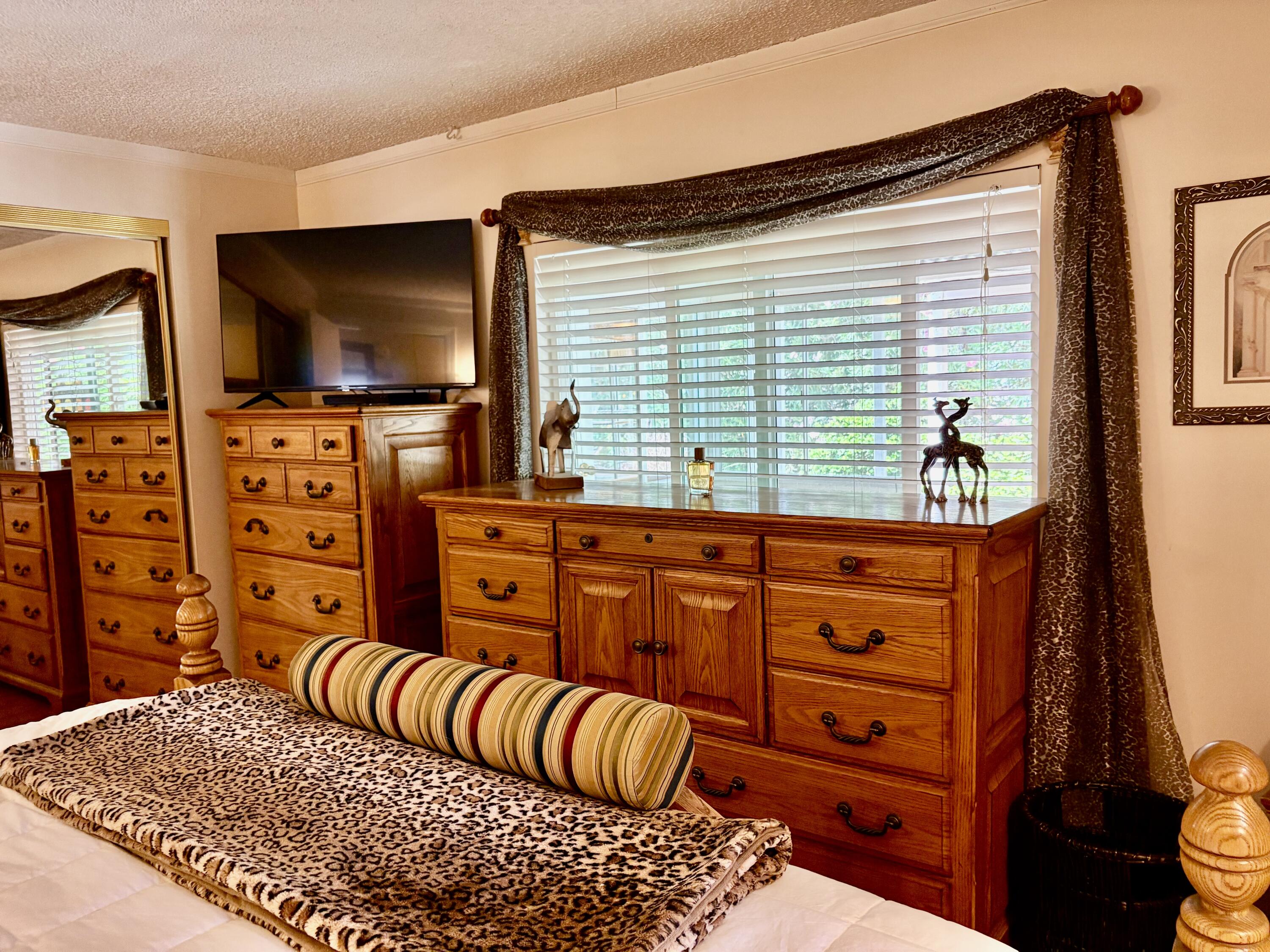 74711 Dillon Road, Unit 635 Desert Hot Springs, CA 92241 - Photo 11 of 55 a living room with furniture and a flat screen tv