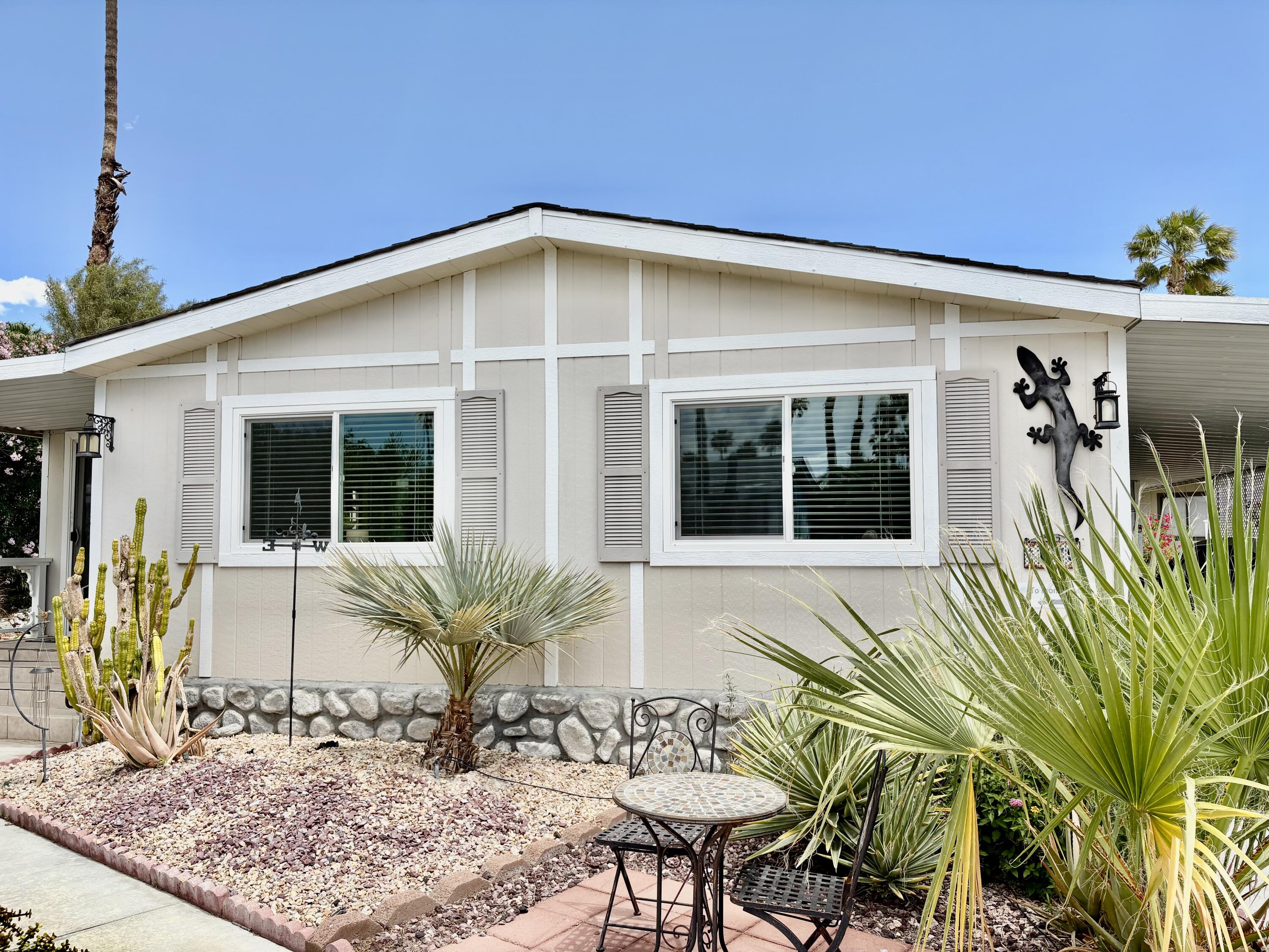 74711 Dillon Road, Unit 635 Desert Hot Springs, CA 92241 - Photo 2 of 55 a view of a house with a patio