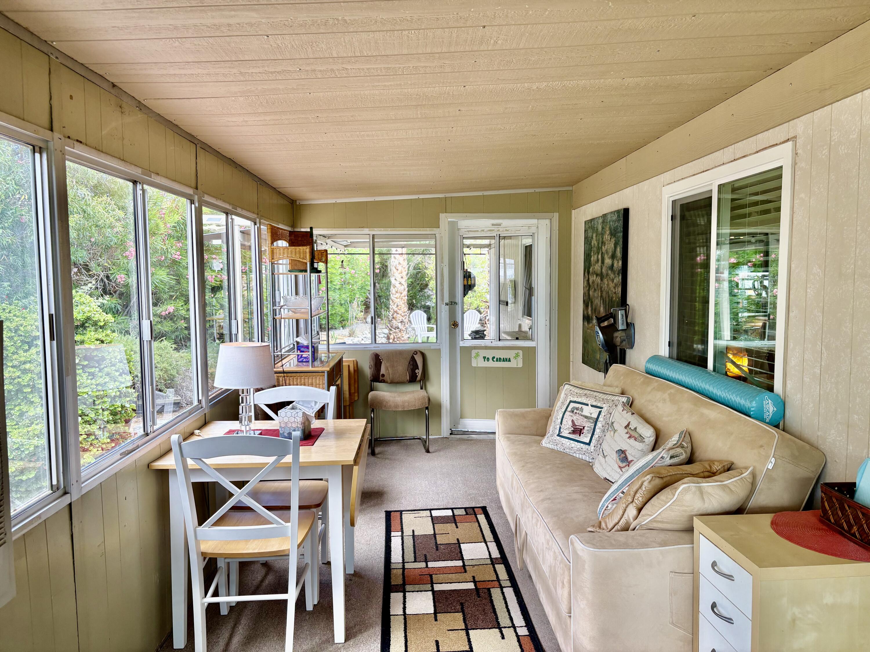 74711 Dillon Road, Unit 635 Desert Hot Springs, CA 92241 - Photo 21 of 55 a living room with furniture and large windows