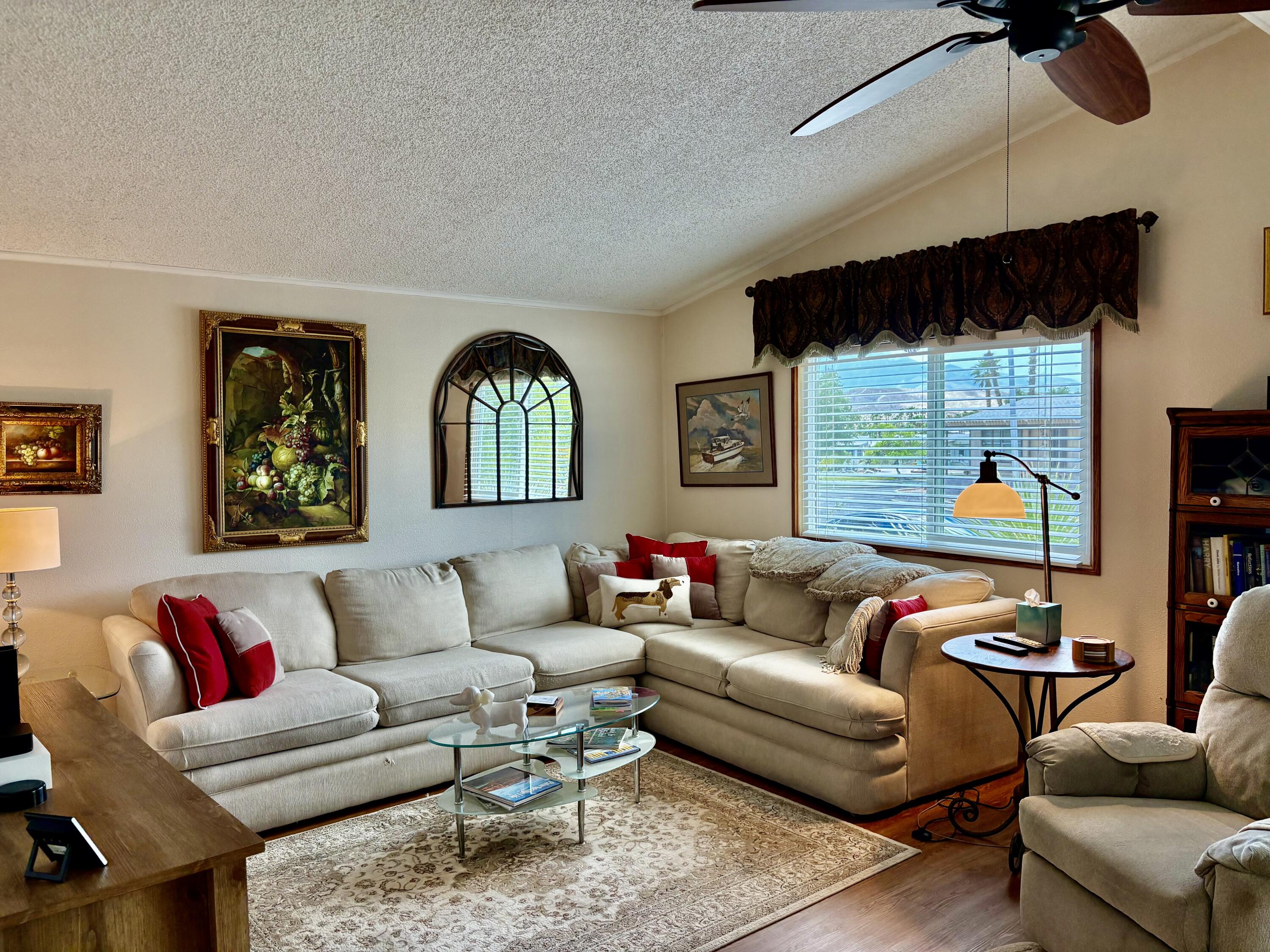 74711 Dillon Road, Unit 635 Desert Hot Springs, CA 92241 - Photo 3 of 55 a living room with furniture and a large window