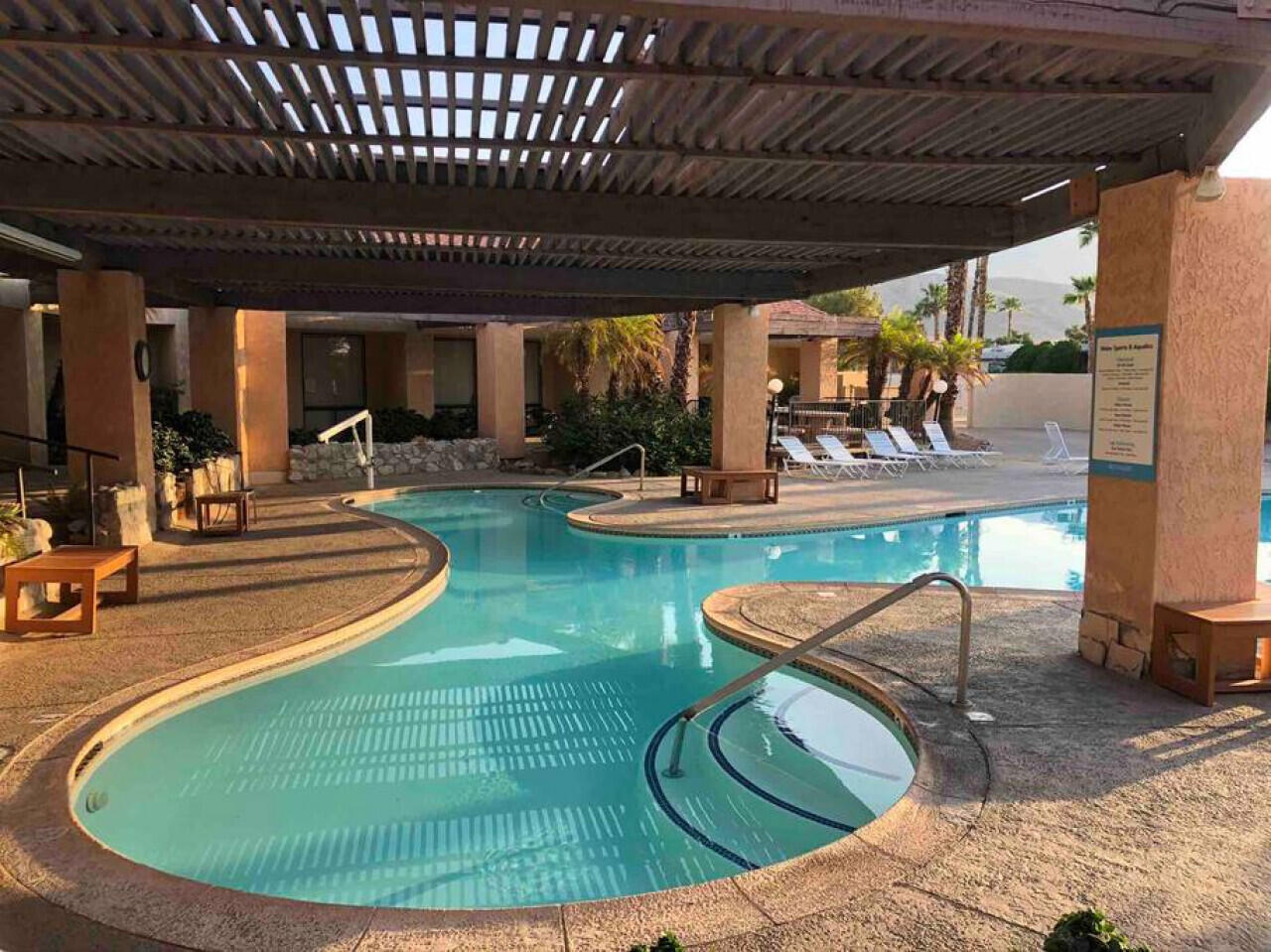 74711 Dillon Road, Unit 635 Desert Hot Springs, CA 92241 - Photo 37 of 55 a view of a swimming pool with seating space
