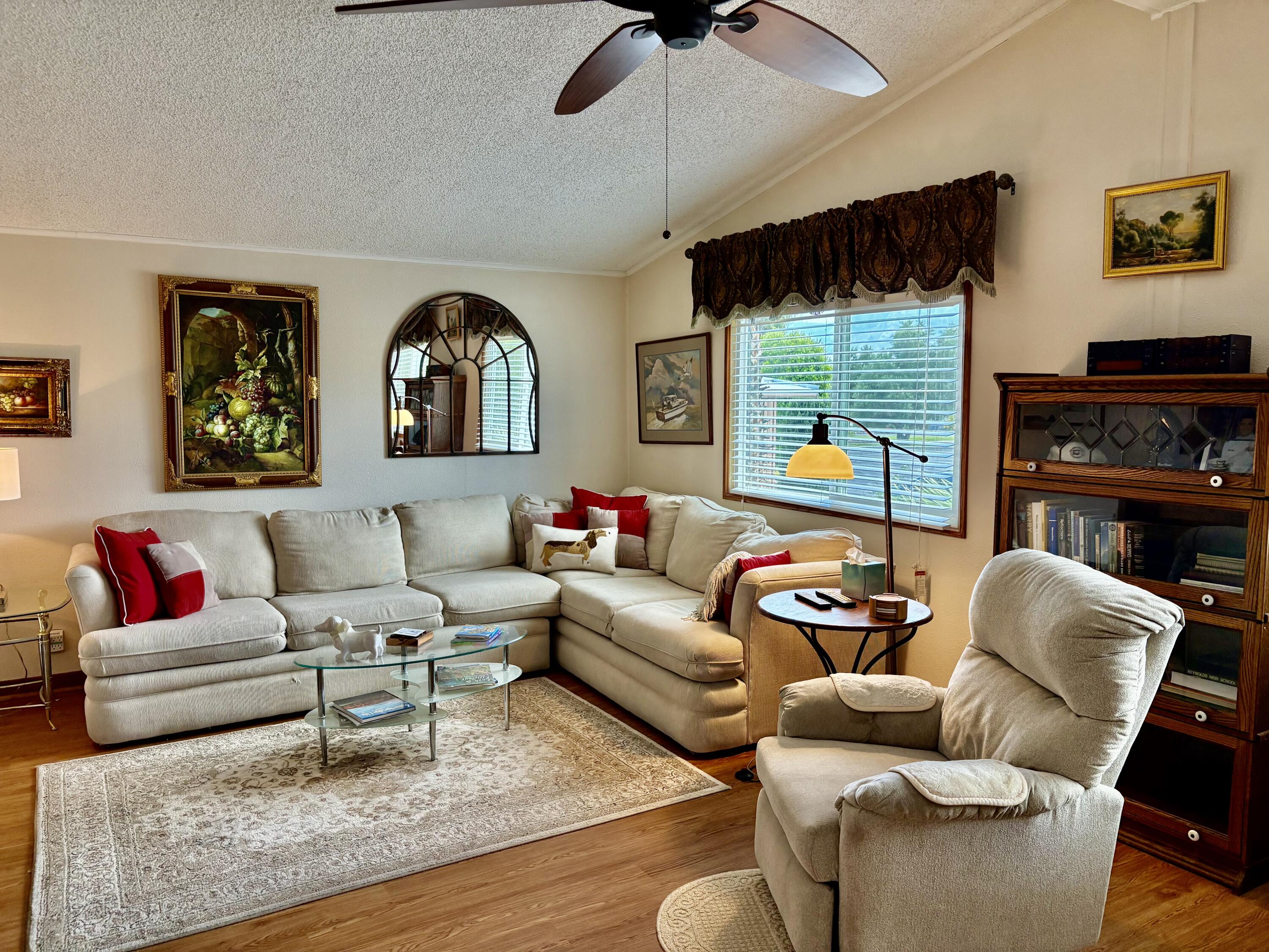 74711 Dillon Road, Unit 635 Desert Hot Springs, CA 92241 - Photo 4 of 55 a living room with furniture fireplace and a large window
