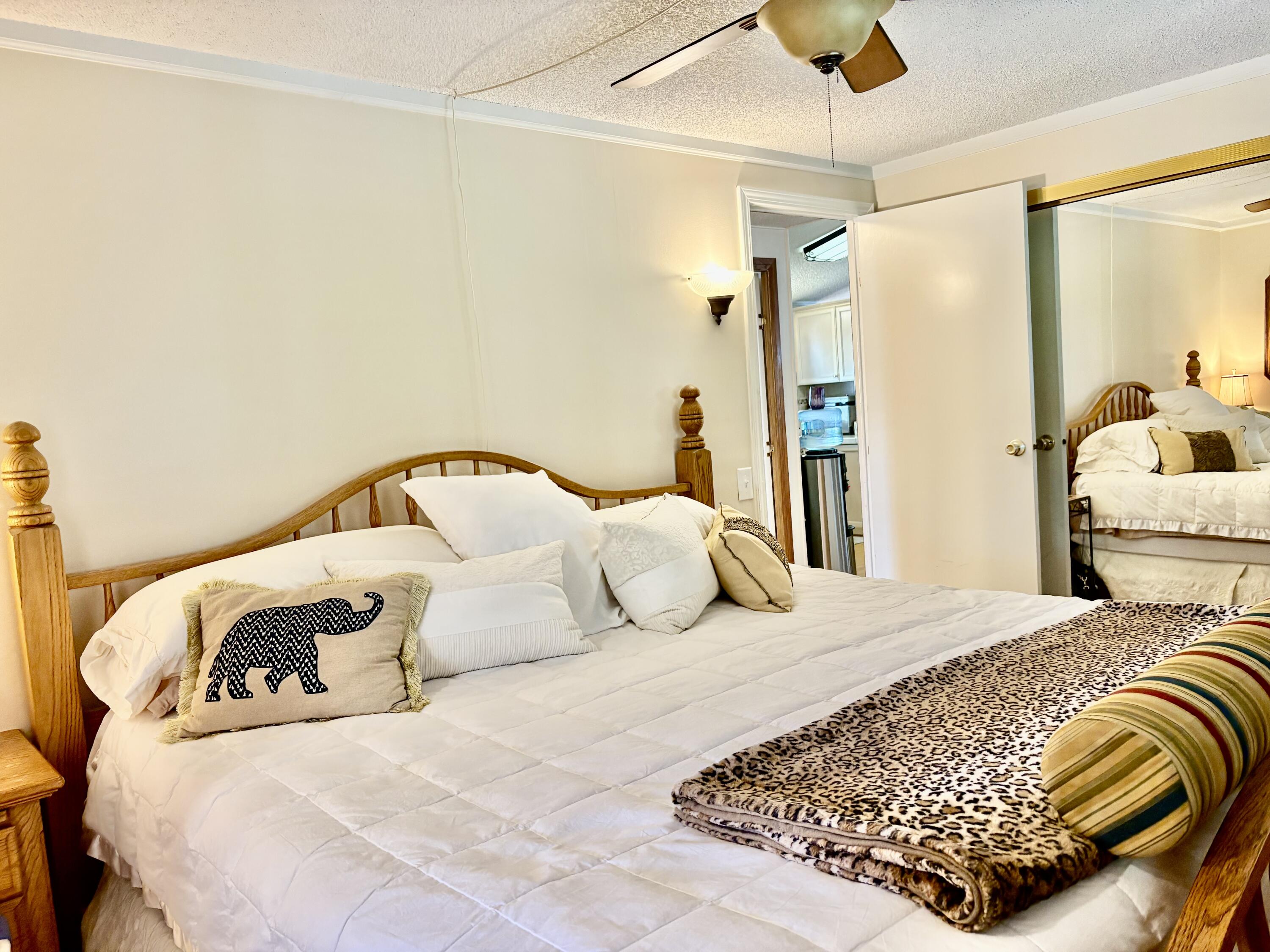 74711 Dillon Road, Unit 635 Desert Hot Springs, CA 92241 - Photo 10 of 55 a bedroom with a bed and a mirror