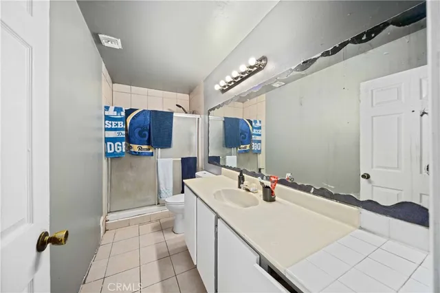 a kitchen with a sink appliances and cabinets